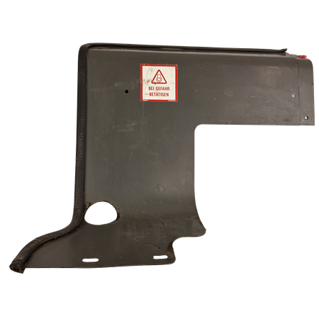 Täckplåt bakom förarstol